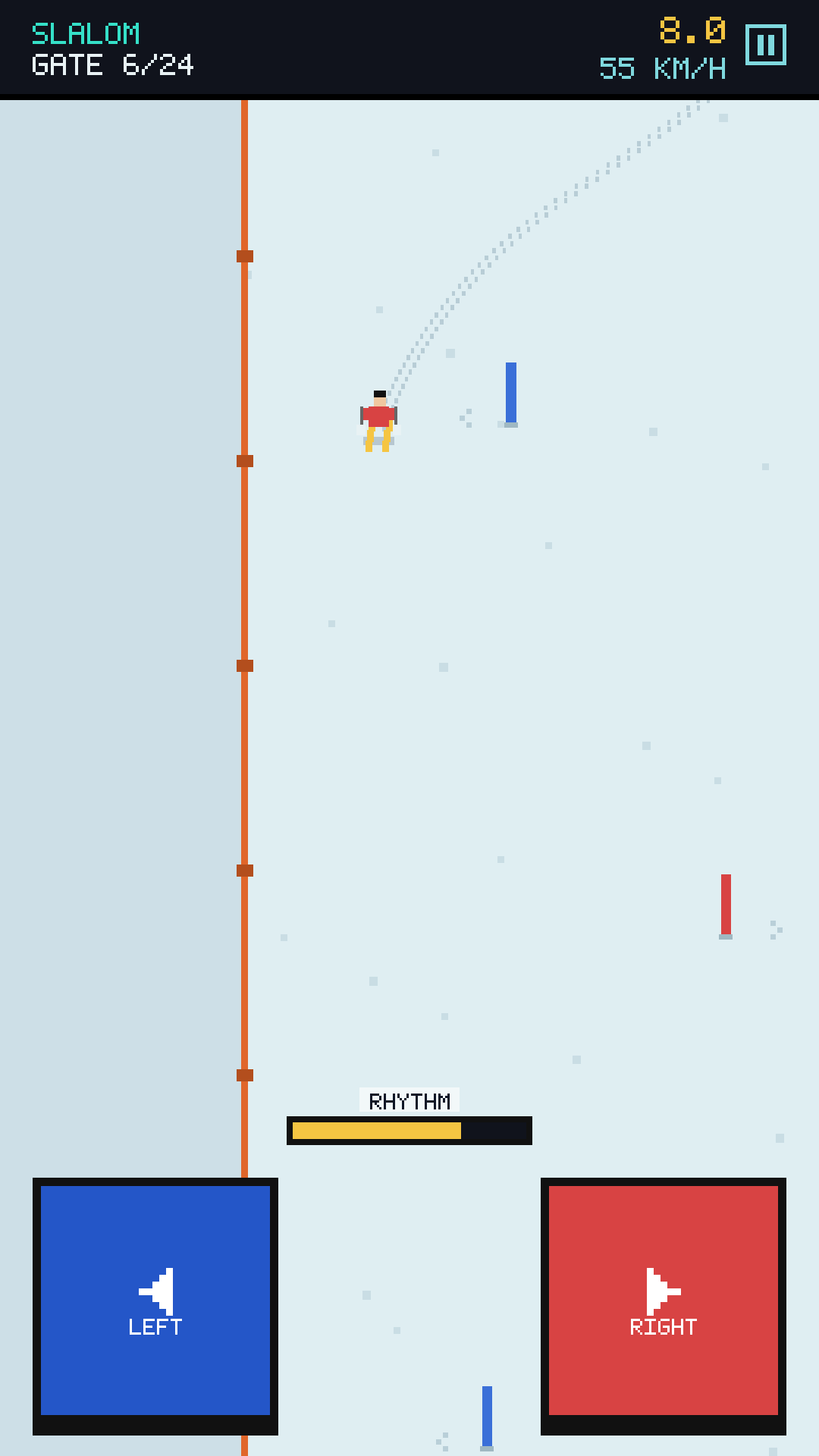 Slalom race: skier carving around red and blue poles on a snowy slope